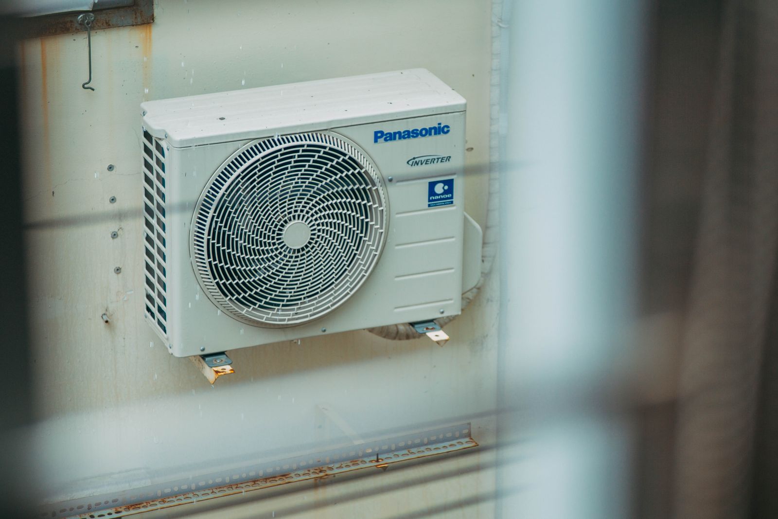 Energy-efficient heat pump outdoor unit on a home